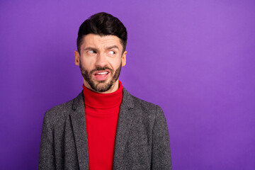 Photo of unhappy nice brown hair man look empty space wear red sweater jacket isolated on vivid purple color background