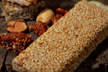 Kozinaki of sesame on the wooden background