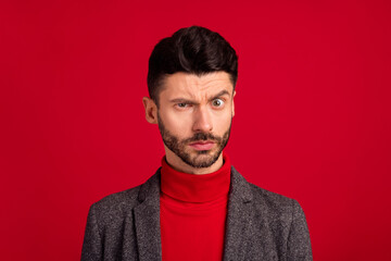 Photo of unsure nice grey brown hair man wear red sweater jacket isolated on vivid color background