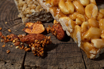 Kozinaki of sesame on the wooden background