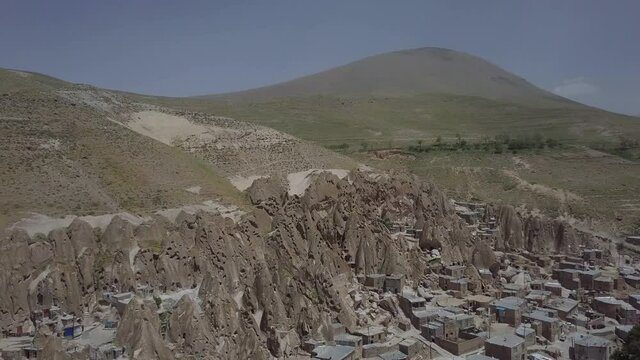 Aerial view overlooking the Kandowan Village, sunny day, in Iran - reverse, drone shot