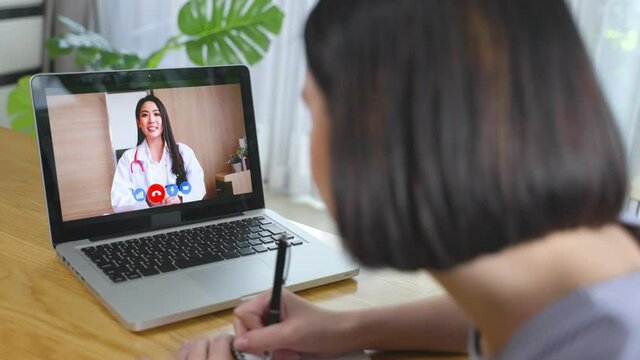 Caucasian young girl consults doctor for health problem on video call.