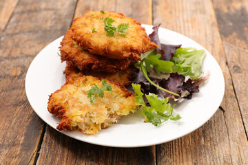 fried potato galette and salad