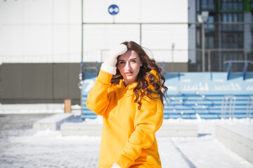 Beautiful and stylish Russian girl model in winter on the street of Moscow