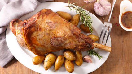 baked lamb leg and potatoes
