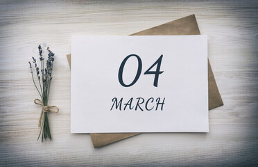 march 04. 04th day of the month, calendar date. White blank of paper with a brown envelope, dry bouquet of lavender flowers on a wooden background. Spring month, day of the year concept