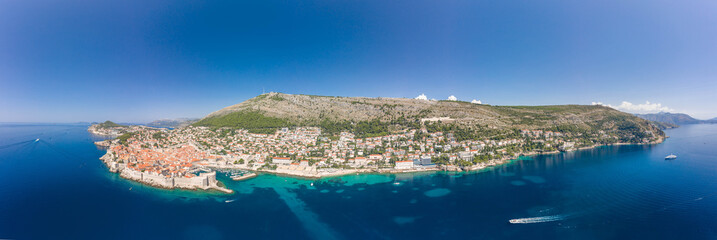 Naklejka premium Aerial panorama drone shot of Old Port in Dubrovnik old town by Adriatic sea in Croatia summer noon