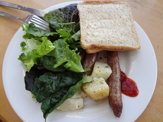 Simple Breakfast, potato, salad, sausage and white bread