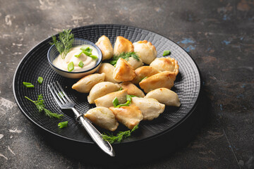 Dumplings, pelmeni, ravioli, pierogi on the table	