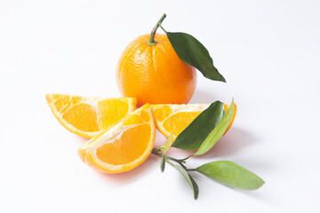 Orange fruit with slices and leaves isolated on white background. Fresh citrus composition.