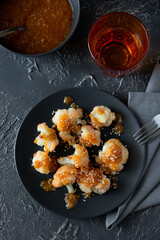 Buffalo barbecue cauliflower on dark background. Top view. Summer food concept
