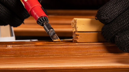 restoration of wooden doors with wax.,elimination of defects chips