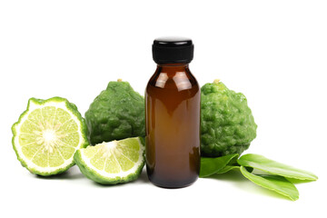 Bergamot oil in bottle and fresh bergamot fruit with green leaf isolated on white background.