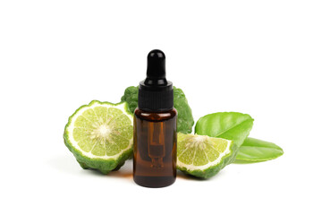 Bergamot oil in bottle and fresh bergamot fruit with green leaf isolated on white background.