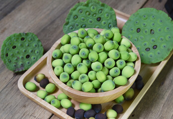 fresh lotus seeds in the wooden cup . it is a herbal fruits and using in Chinese herbal medicine