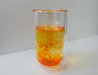water in a glass colored with manganese, beautiful patterns