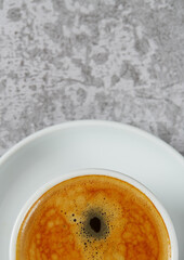 cup of black coffee on stone surface