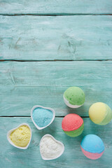 bath bombs and milk on turquoise surface