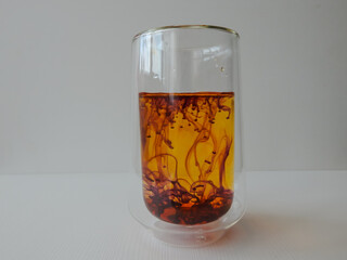 water in a glass colored with manganese, beautiful patterns