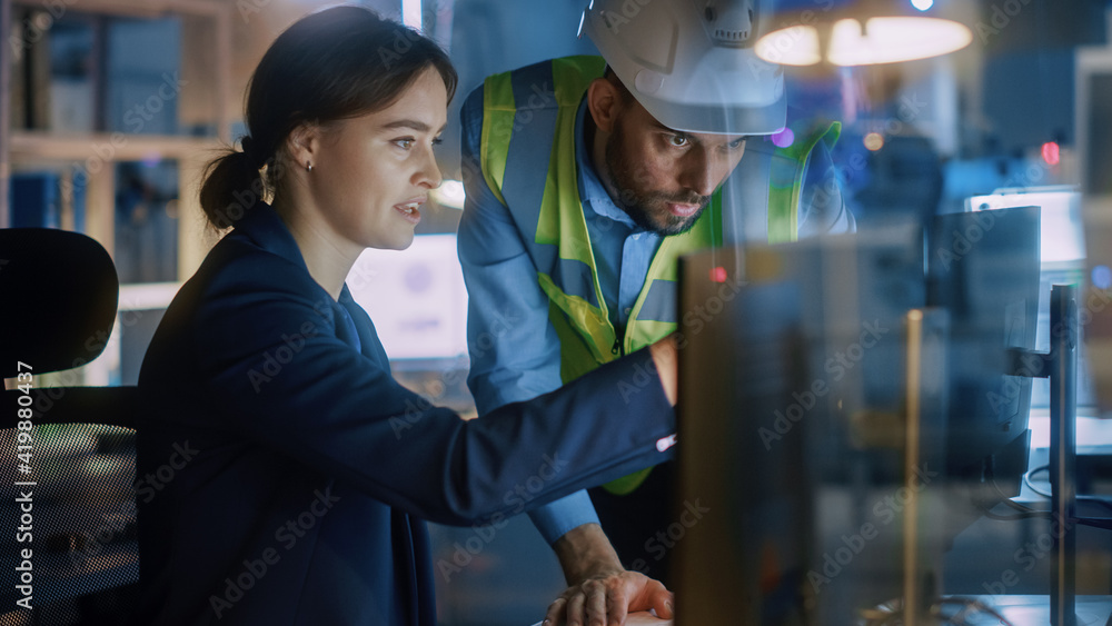 Aufkleber modern factory office: male project manager talks to a female industrial engineer who works on compu