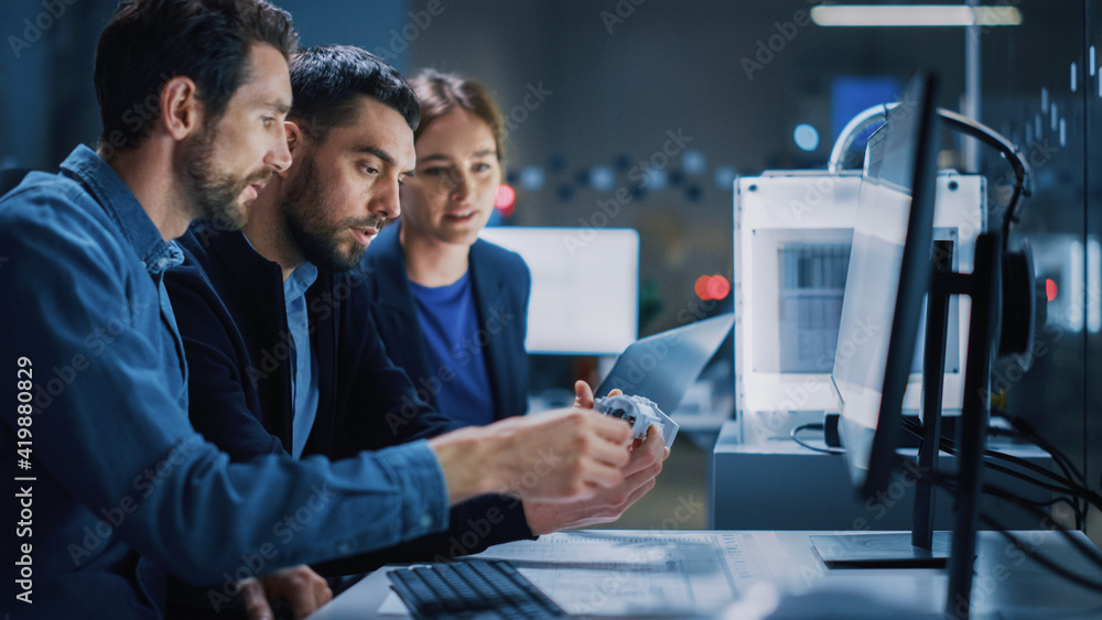 Fototapete Industry 4.0 Modern Factory: Team of Innovative Industrial Engineers Use Computer and 3D Printer to Build Complex Component. Group of Scientists Use High-Tech Machinery for Futuristic Design