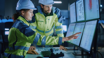 Industry 4.0 Modern Factory: Project Engineer Talks to Female Operator who Controls Facility...
