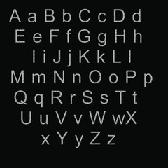 English alphabet. White letters with black specks. 