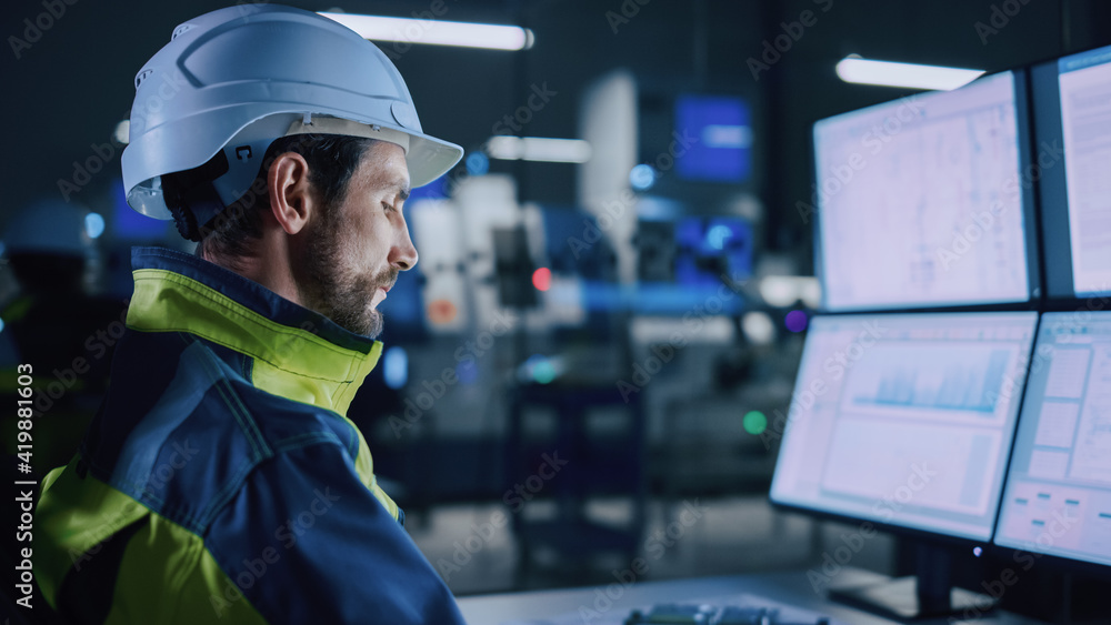 Poster Industry 4.0 Modern Factory: Portrait of Facility Operator Controls Workshop Production Line, Uses Computer with Screens Showing Complex UI of Machine Operation Processes, Controllers