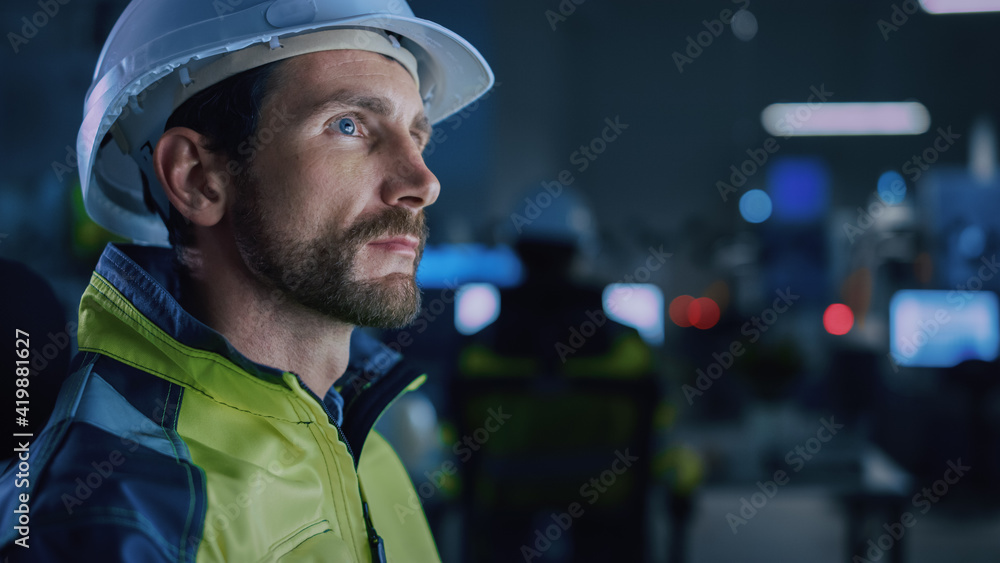 Poster Industry 4.0 Modern Factory: Portrait of Facility Operator Controls Workshop Production Line, Uses Computer with Screens Showing Complex UI of Machine Operation Processes, Controllers