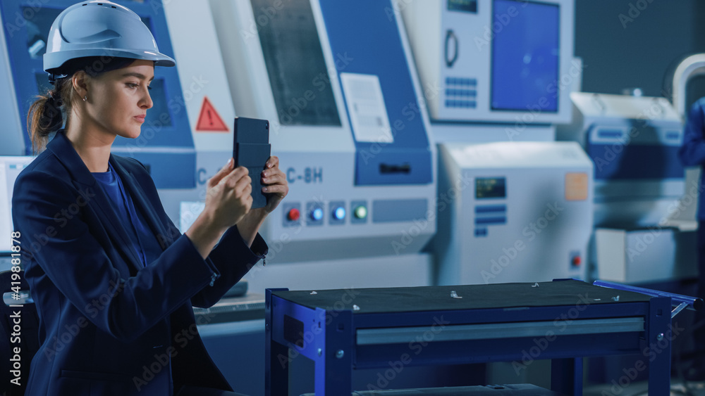 Fototapete Portrait Shot of Professional Female Engineer Uses Industrial Digital Tablet to Work with Augmented Reality. Great Template Shot for Augmented Reality. Factory Workshop with CNC Machinery.