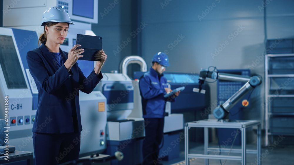 Leinwandbilder Portrait Shot of Professional Female Engineer Uses Industrial Digital Tablet to Work with Augmented Reality. Great Template Shot for Augmented Reality. Factory Workshop with CNC Machinery.