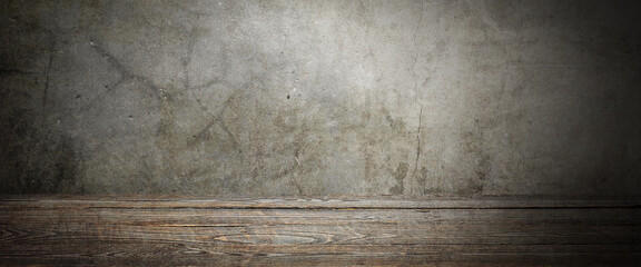Wooden decking table on a grey grunge background.