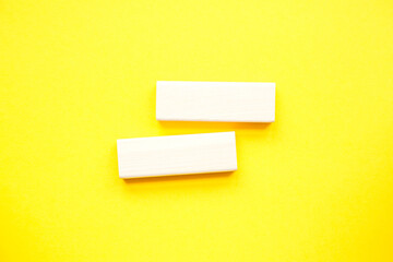 Stack wooden blocks on a yellow background