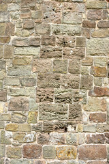 Old pock marked stone wall example