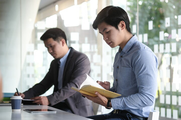 Business people in the office are planning a strategy for the future of the business.	