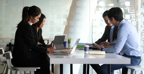 Business people in the office are planning a strategy for the future of the business.	