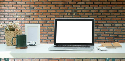 Modern workspace with computer with blank screen and equipment on white table.Blank screen for your information.