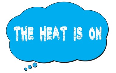 THE  HEAT  IS  ON text written on a blue thought bubble.