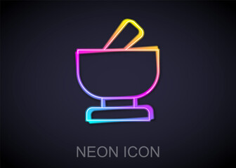 Glowing neon line Mortar and pestle icon isolated on black background. Vector