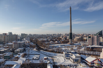 High TV tower and panoramic view of the rest of the city of Yekaterinburg on a sunny winter day | YEKATERINBURG, RUSSIA - 24 MARCH 2018.