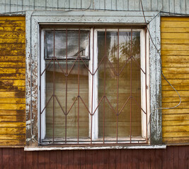 window of an old and abandoned wooden house