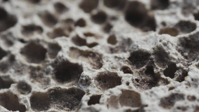 Macro slide shot, the surface of the pumice stone, similar to craters on the moon.