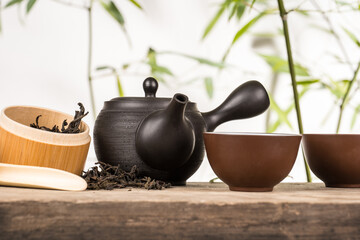 preparation of green loose tea in traditional Japanese ceramics