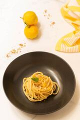 Italian spaghetti with bergamot sauce on top