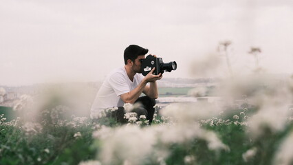 Filmmaker in the field with analogic camera