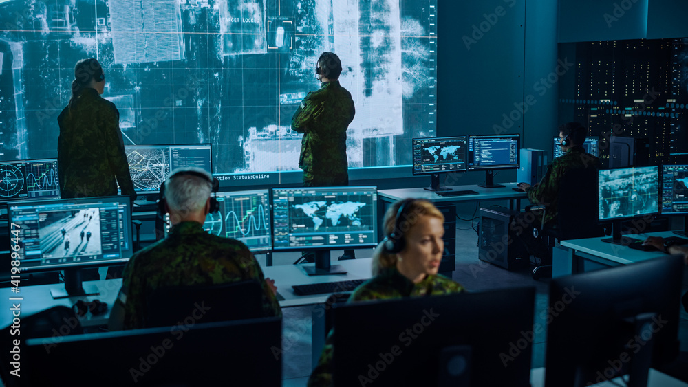 Poster military surveillance team of officers locked a target on a vehicle from a satellite and monitor it 