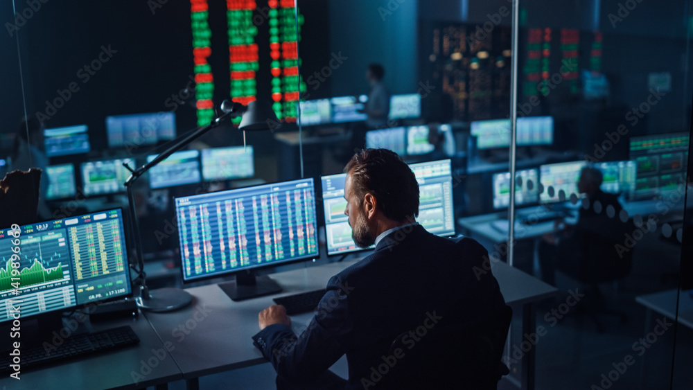 Aufkleber Professional Financial Data Analysts Working in a Modern Monitoring Office with Live Analytics Feed on a Big Digital Screen. Monitoring Room with Finance Specialists Sit in Front of Computers. 