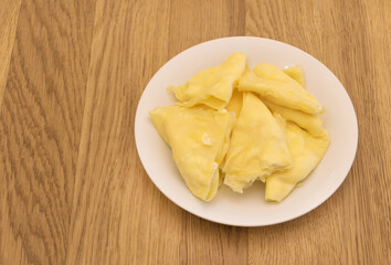 Homemade sweet and tasty pancakes with cheese on wooden background