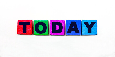 The word TODAY is written on colorful cubes on a light background