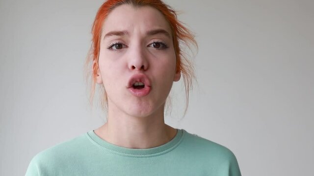 dissatisfied woman gesturing while complaining isolated on white